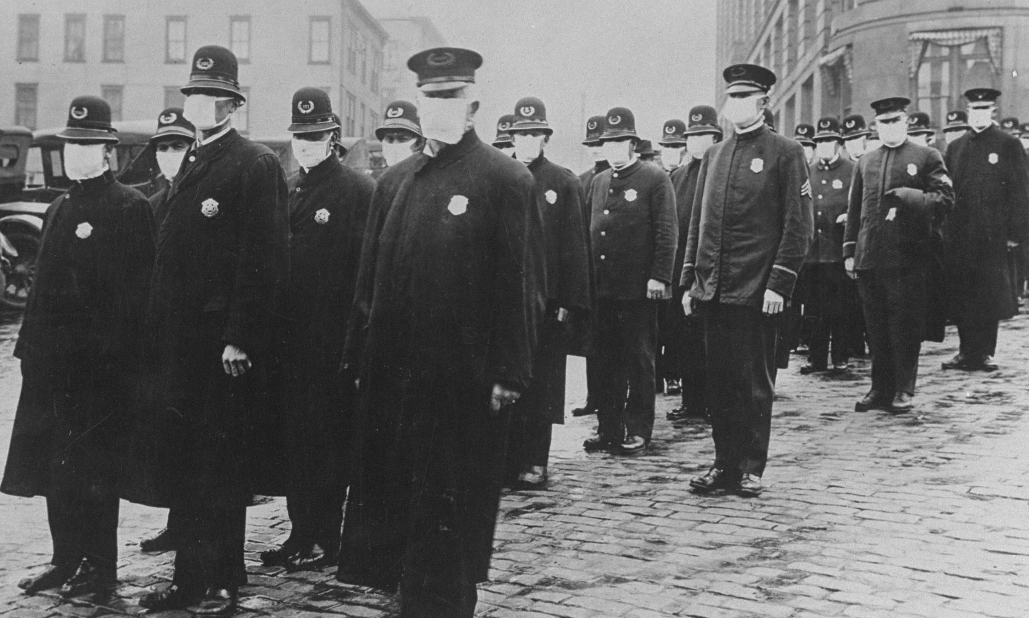 Seattle policemen wearing protective gauze face masks