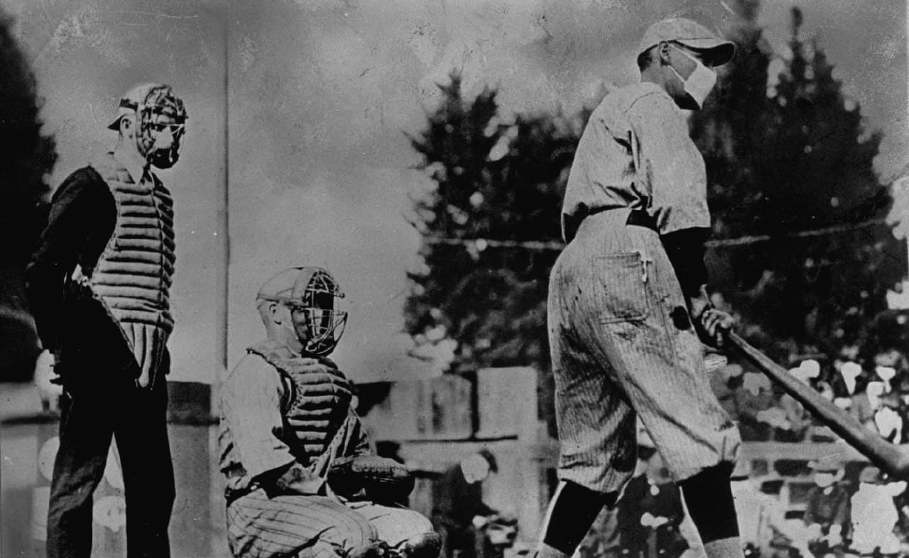 Baseball players wearing masks